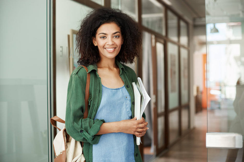 young-beautiful-african-woman-student-resting-relaxing-sitting-in-cafe-smiling-drinking-coffee